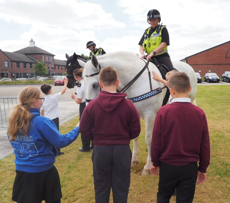 Students engaging with rider