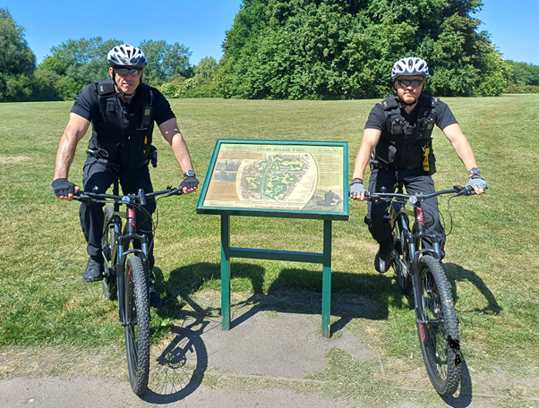 Two officers on ebikes in the sunshine